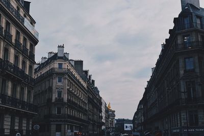 Low angle view of buildings in city against sky