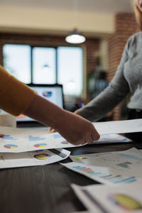 Midsection of business colleagues working at office