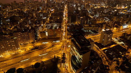 High angle view of illuminated cityscape at night