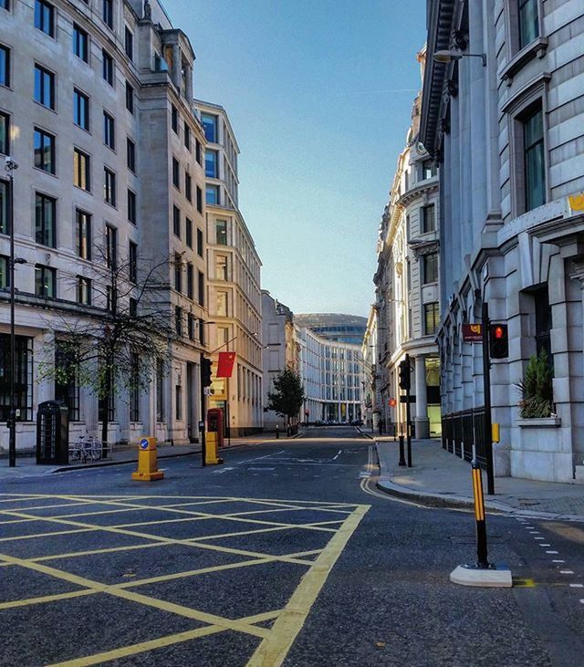 building exterior, architecture, built structure, street, city, the way forward, walking, building, city life, road, cobblestone, residential building, city street, residential structure, men, incidental people, transportation, day, sunlight