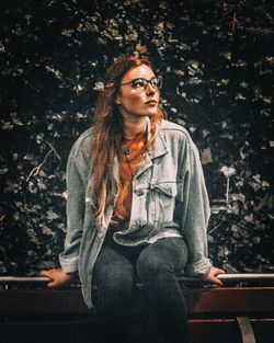 Young woman sitting outdoors