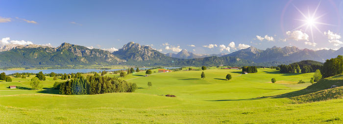 Wide angle view to beautiful landscape in bavaria with rural scene and alps mountain range