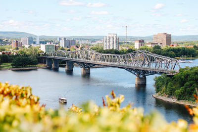 High angle view of alexandra bridge over river against sky in city during sunny day