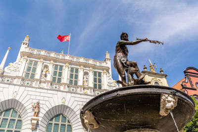 Low angle view of statue against sky