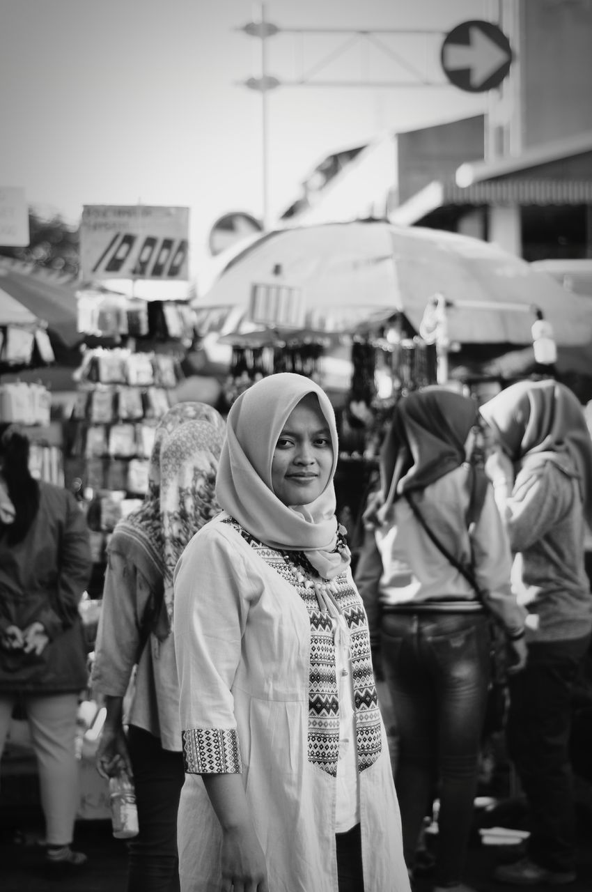 PEOPLE ON STREET IN CITY