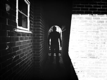 Man walking in front of building