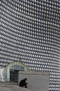 Full length of man photographing building