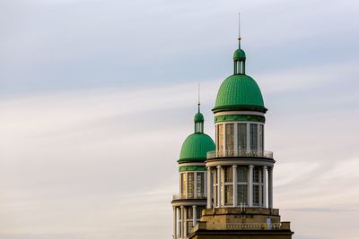 Buildings in city against sky