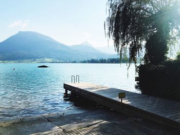 Pier over lake against sky