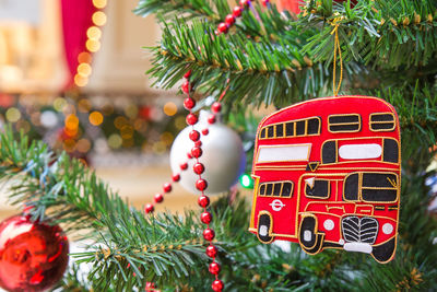 Close-up of christmas decorations hanging on tree