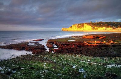 Scenic view of sea against sky during sunset