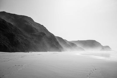 Scenic view of beach against clear sky