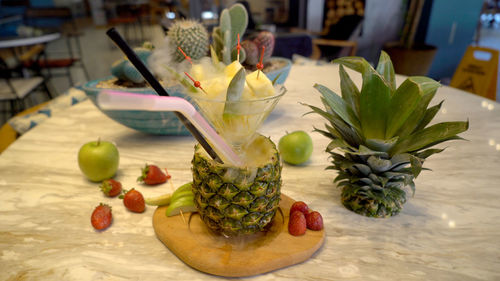 Close-up of fruits in jar on table