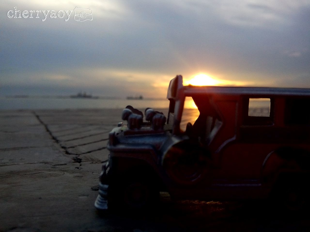 sunset, sky, transportation, mode of transport, land vehicle, sun, sunlight, cloud - sky, beach, abandoned, sea, car, nature, outdoors, sunbeam, stationary, no people, nautical vessel, tranquility, lens flare