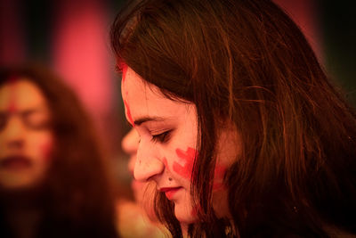 Side view of woman with powder paint on face