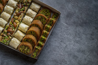 Arabic and turkish oriental sweets desserts made of pistachios and kunafa with leafy dough