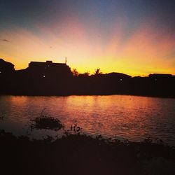 Scenic view of lake at sunset