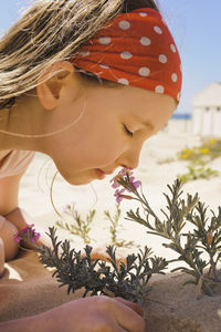 Girl smelling flowers