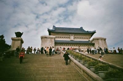 Group of people in front of historical building