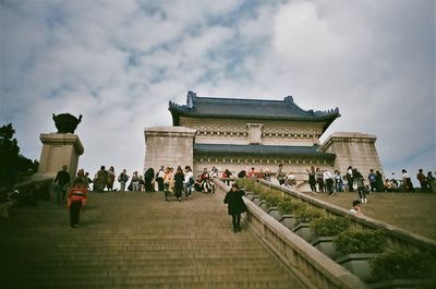 Group of people in front of historical building