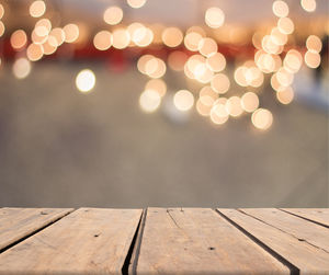 Close-up of table by sea against sky