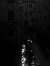 Reflection of buildings in water at night