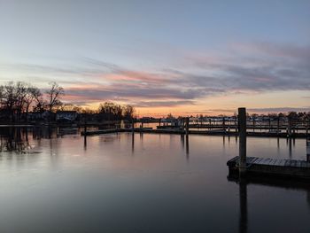 Scenic view of river against sky during sunset