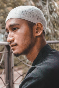 Close-up portrait of man looking away