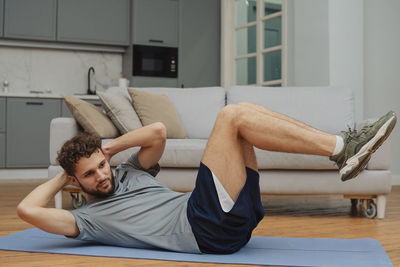 Young woman sitting on table