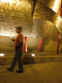 Full length of woman standing at night