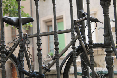 Close-up of bicycle on railing