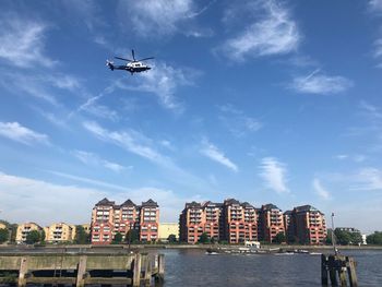 Low angle view of airplane flying against sky