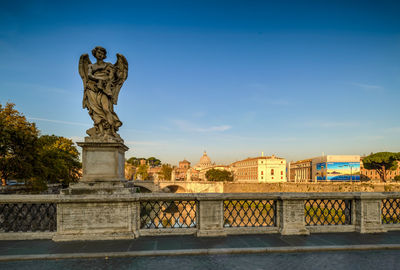 Statue of ponte sant'angelo over river in city of rome
