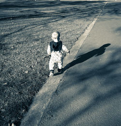 High angle view of girl on road