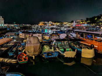 Boats moored at harbor