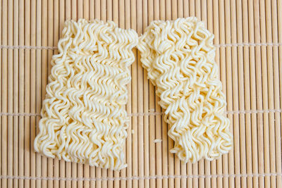 High angle view of noodles on wood