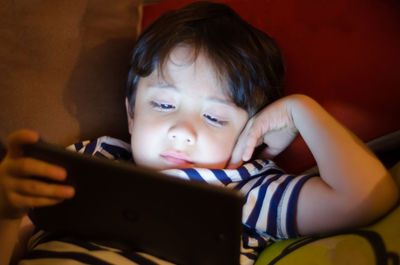 Close-up of girl using mobile phone