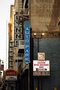 Information sign on building at night