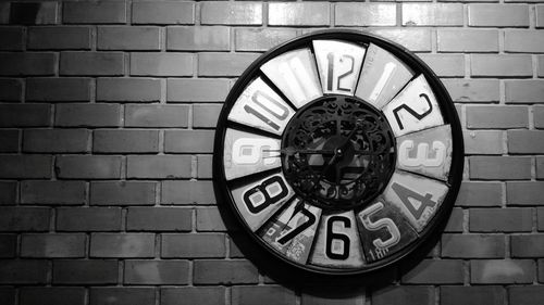 Close-up of clock on wall