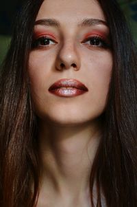 Close-up portrait of young woman with make-up