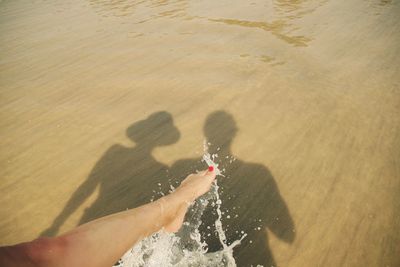 High angle view of shadows on beach