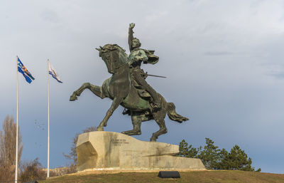 Low angle view of statue against sky