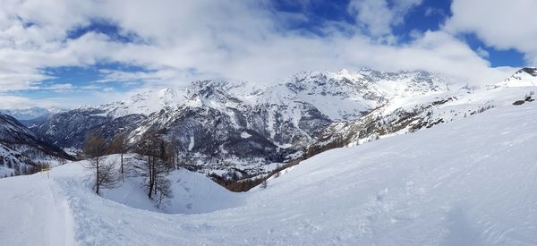 Scenic view of snowcapped mountains against sky