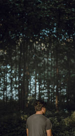 Man standing in forest