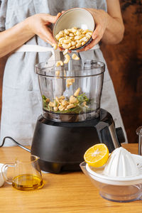 Midsection of woman preparing food on table