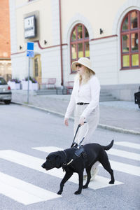 Woman walking with assistance dog