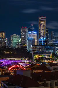 High angle view of illuminated buildings in city at night