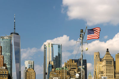 Low angle view of modern buildings against sky in city