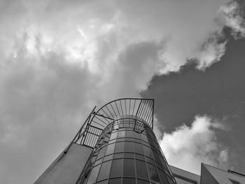 Low angle view of building against cloudy sky