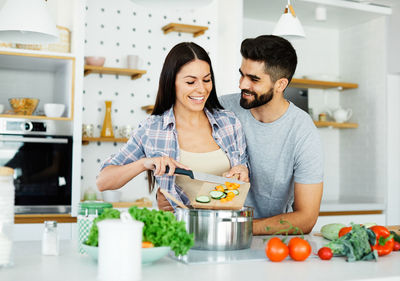 Man and woman having food at home